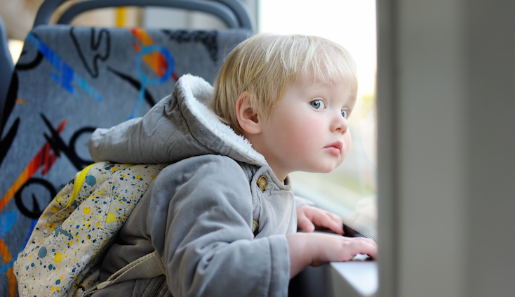 Staycation or Vacation - Child looking out window